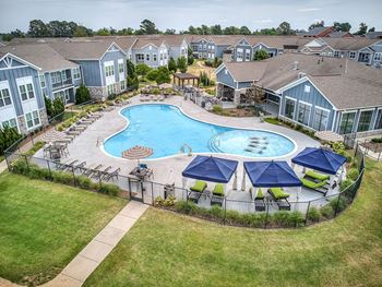 Resort-style swimming pool with cabanas